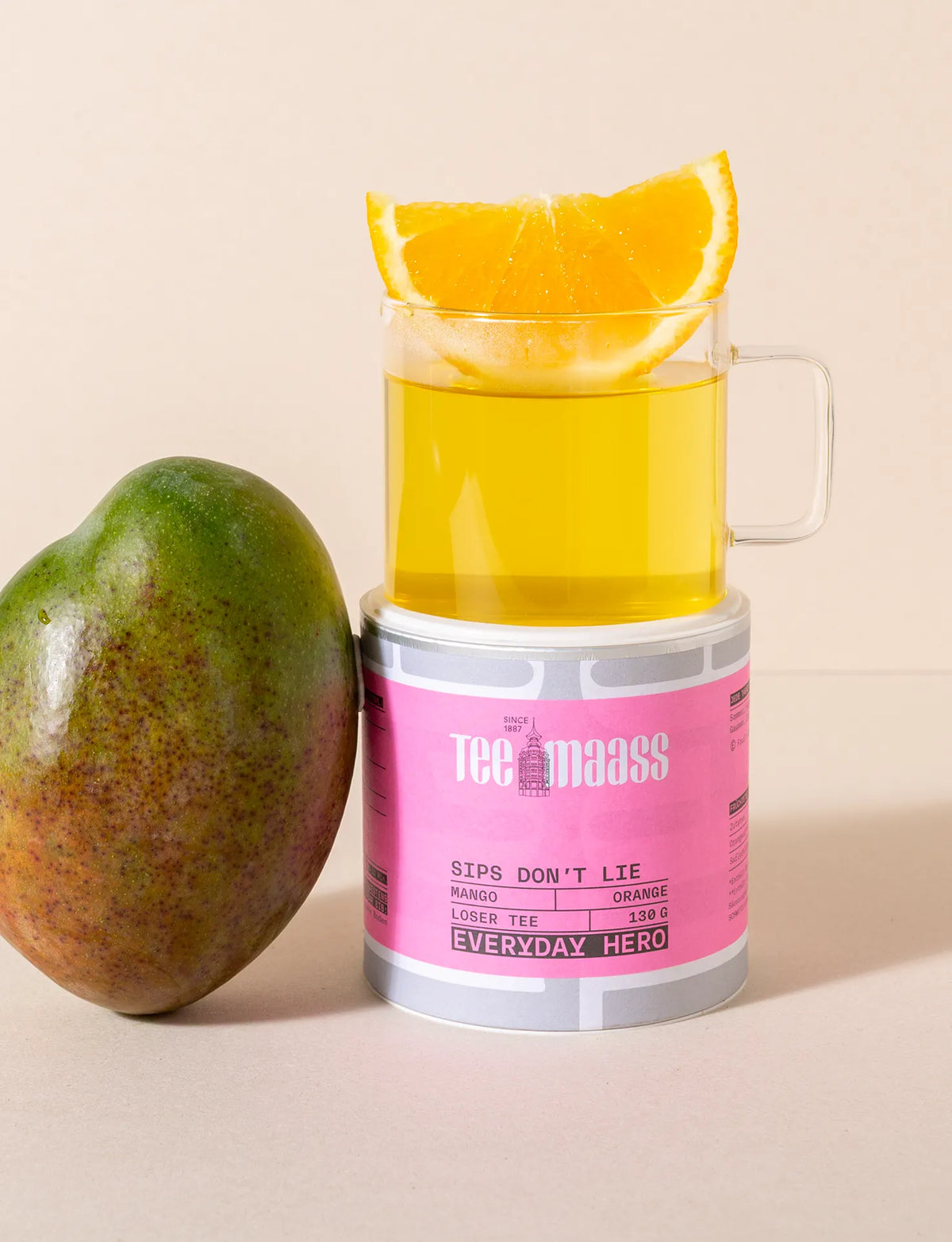 Tee Maass Mango Orange loser Tee in Dose mit Mango und Orangenscheibe.