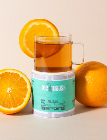 Tee Maass Quit Coffee Mate Orange mit Orangenscheibe im Glas.